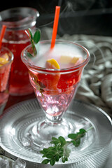Refreshing summer alcoholic cocktail with crushed ice and citrus fruits