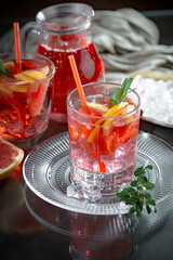 Refreshing summer alcoholic cocktail with crushed ice and citrus fruits