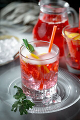 Cocktail in a glass with fruit on an old background.