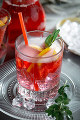 Refreshing summer alcoholic cocktail with crushed ice and citrus fruits