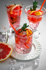 Refreshing summer alcoholic cocktail with crushed ice and citrus fruits