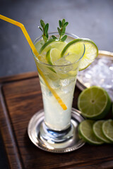 Fruit cocktail, in a glass with natural healthy fruits on a table with kitchen accessories.