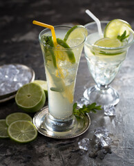 Fruit cocktail, in a glass with natural healthy fruits on a table with kitchen accessories.