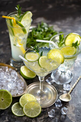 Fruit cocktail, in a glass with natural healthy fruits on a table with kitchen accessories.