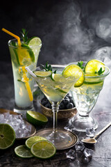 Cocktail in a glass with fruit on an old background.