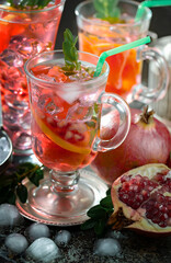 Cocktail in a glass with fruit on an old background.