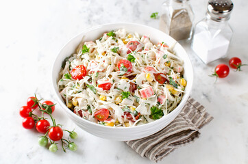 Salad with crab sticks, cabbage and tomatoes