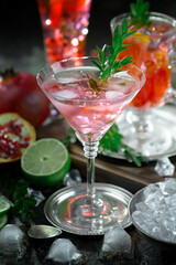 Fruit cocktail, in a glass with natural healthy fruits on a table with kitchen accessories.