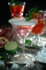 Fruit cocktail, in a glass with natural healthy fruits on a table with kitchen accessories.