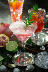 Fruit cocktail, in a glass with natural healthy fruits on a table with kitchen accessories.