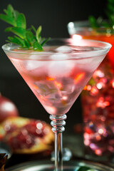 Fruit cocktail, in a glass with natural healthy fruits on a table with kitchen accessories.