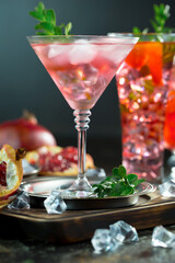 Fruit cocktail, in a glass with natural healthy fruits on a table with kitchen accessories.