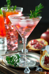 Fruit cocktail, in a glass with natural healthy fruits on a table with kitchen accessories.