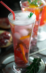 Refreshing summer alcoholic cocktail with crushed ice and citrus fruits