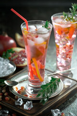 Fruit cocktail, in a glass with natural healthy fruits on a table with kitchen accessories.