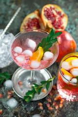 Cocktail in a glass with fruit on an old background.