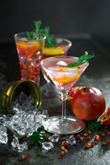 Fruit cocktail, in a glass with natural healthy fruits on a table with kitchen accessories.