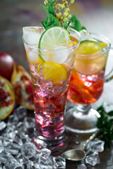 Cocktail in a glass with fruit on an old background.