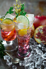 Fruit cocktail, in a glass with natural healthy fruits on a table with kitchen accessories.