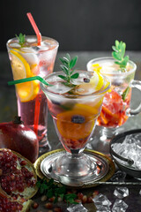 Refreshing summer alcoholic cocktail with crushed ice and citrus fruits