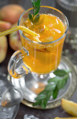 Cocktail in a glass with fruit on an old background.