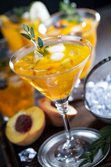 Fruit cocktail, in a glass with natural healthy fruits on a table with kitchen accessories.