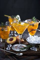 Fruit cocktail, in a glass with natural healthy fruits on a table with kitchen accessories.