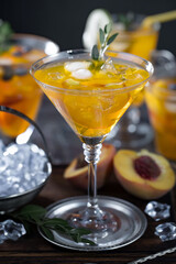 Fruit cocktail, in a glass with natural healthy fruits on a table with kitchen accessories.