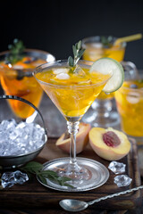 Fruit cocktail, in a glass with natural healthy fruits on a table with kitchen accessories.