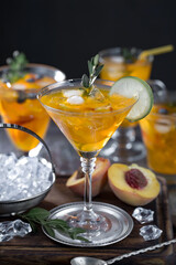 Cocktail in a glass with fruit on an old background.