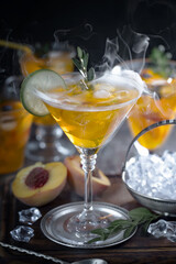 Fruit cocktail, in a glass with natural healthy fruits on a table with kitchen accessories.