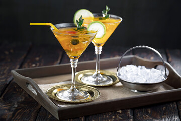 Fruit cocktail, in a glass with natural healthy fruits on a table with kitchen accessories.