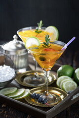 Fruit cocktail, in a glass with natural healthy fruits on a table with kitchen accessories.