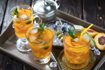 Refreshing summer alcoholic cocktail with crushed ice and citrus fruits