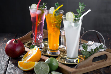 Cocktail in a glass with fruit on an old background.