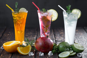 Fruit cocktail, in a glass with natural healthy fruits on a table with kitchen accessories.