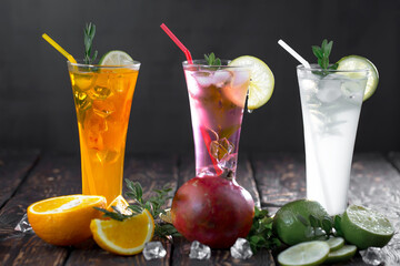 Cocktail in a glass with fruit on an old background.