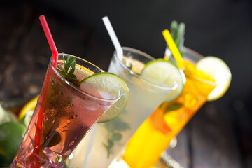 Cocktail in a glass with fruit on an old background.