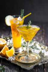 Fruit cocktail, in a glass with natural healthy fruits on a table with kitchen accessories.