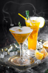 Cocktail in a glass with fruit on an old background.