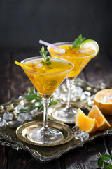 Refreshing summer alcoholic cocktail with crushed ice and citrus fruits