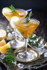 Refreshing summer alcoholic cocktail with crushed ice and citrus fruits