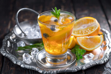 Refreshing summer alcoholic cocktail with crushed ice and citrus fruits