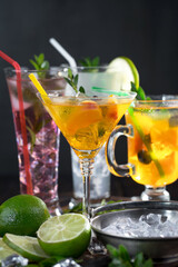 Fruit cocktail, in a glass with natural healthy fruits on a table with kitchen accessories.