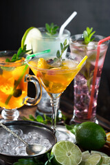 Fruit cocktail, in a glass with natural healthy fruits on a table with kitchen accessories.