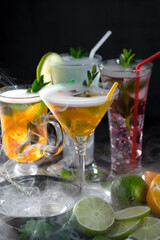 Cocktail in a glass with fruit on an old background.