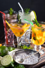 Cocktail in a glass with fruit on an old background.