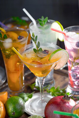 Fruit cocktail, in a glass with natural healthy fruits on a table with kitchen accessories.