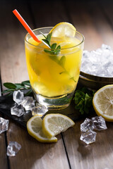 Refreshing summer alcoholic cocktail with crushed ice and citrus fruits
