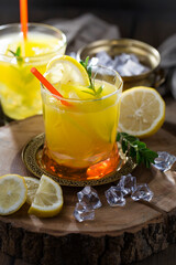 Refreshing summer alcoholic cocktail with crushed ice and citrus fruits